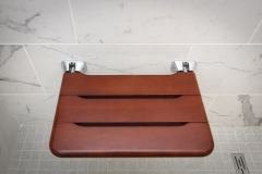 Fold out seat in shower