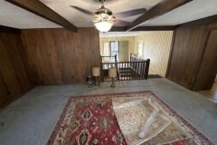 midcentury-reimagined-den-stirwell-and-entry-before