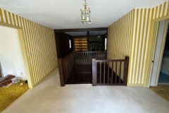 midcentury-reimagined-entry-den-stairwell-before